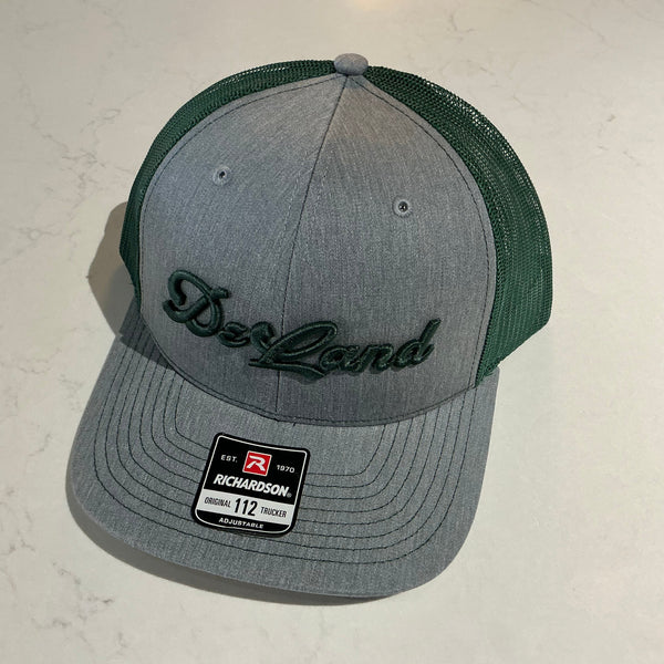 DeLand Apparel Company Cursive DeLand Richardson 112 Trucker